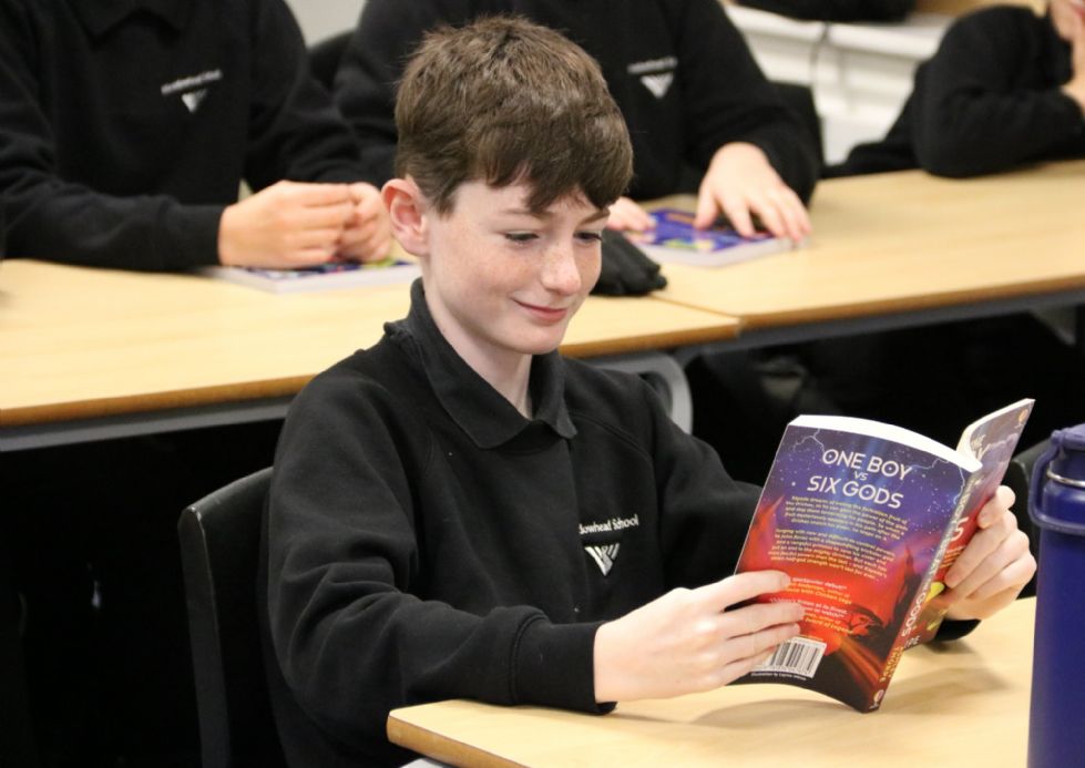 y7 student with their free bookbuzz book