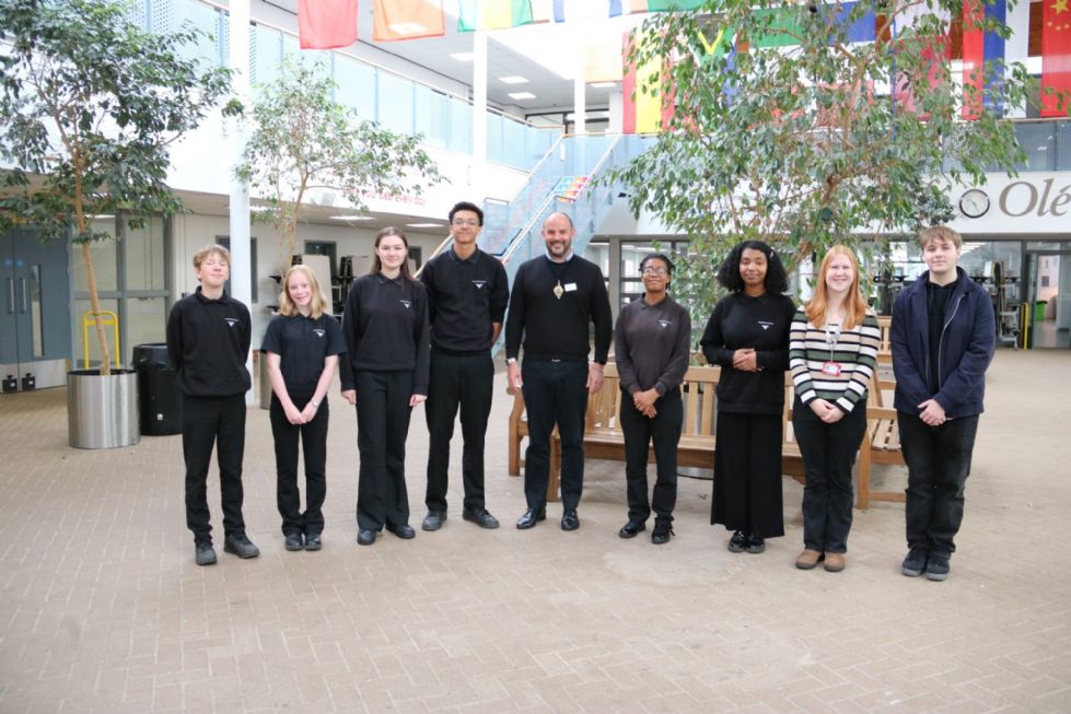 students who supported the event stand for a photo with Alexis Krachai