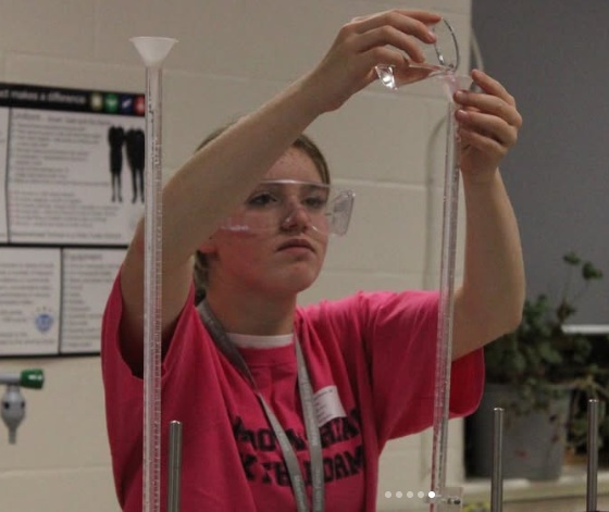 sixth former demonstrating science experiment