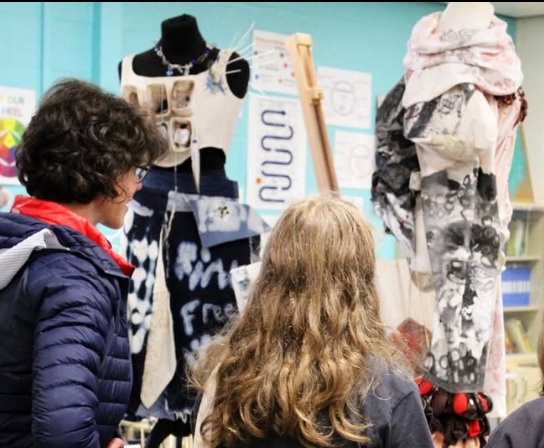 students discussing textiles