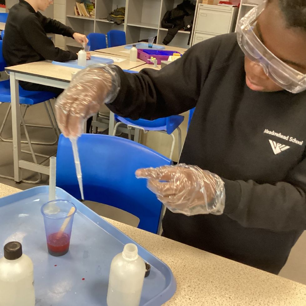 stem club students make magnetic slime