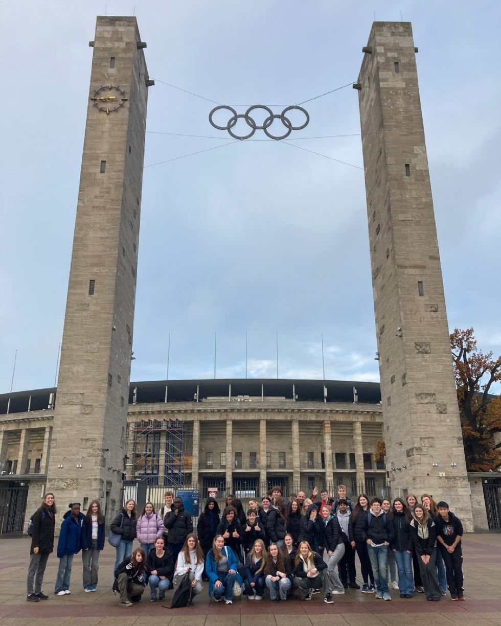 group of students standing outside the olympic stadium in Berlin