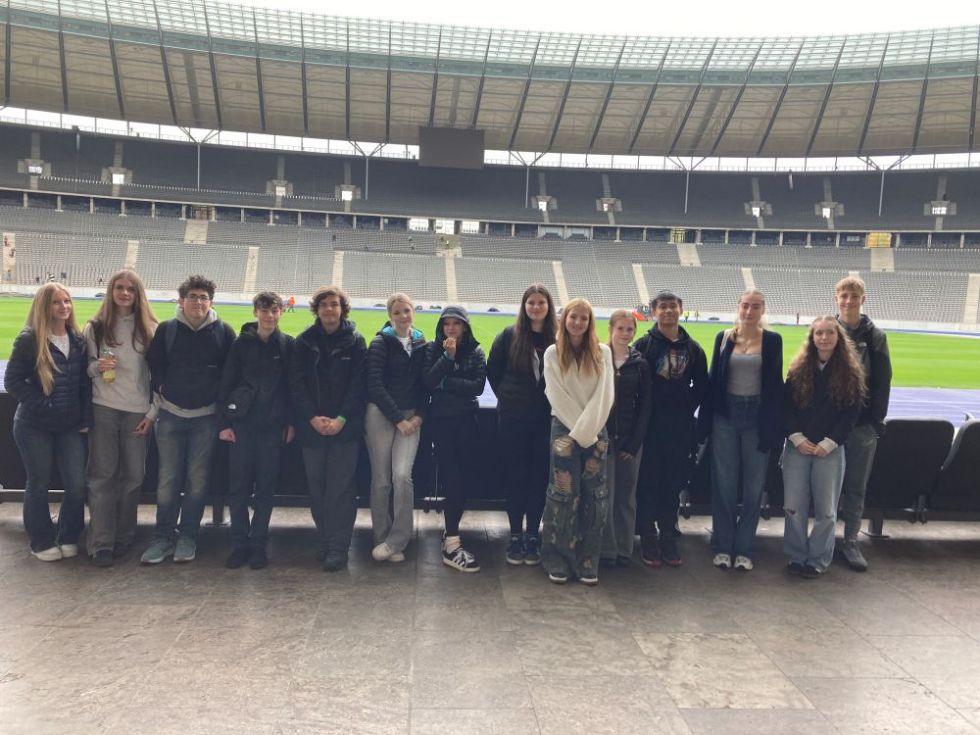 group of students standing inside the olympic stadium in Berlin