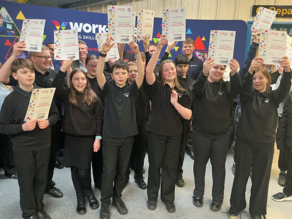 y8 students show off their winning certificates at a competition