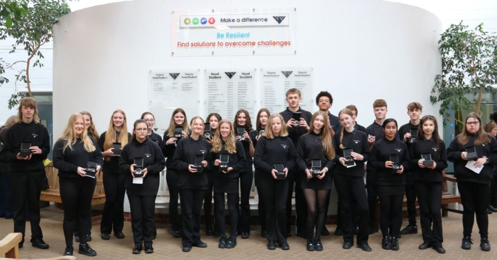 students pose for photo with their double diamond awards