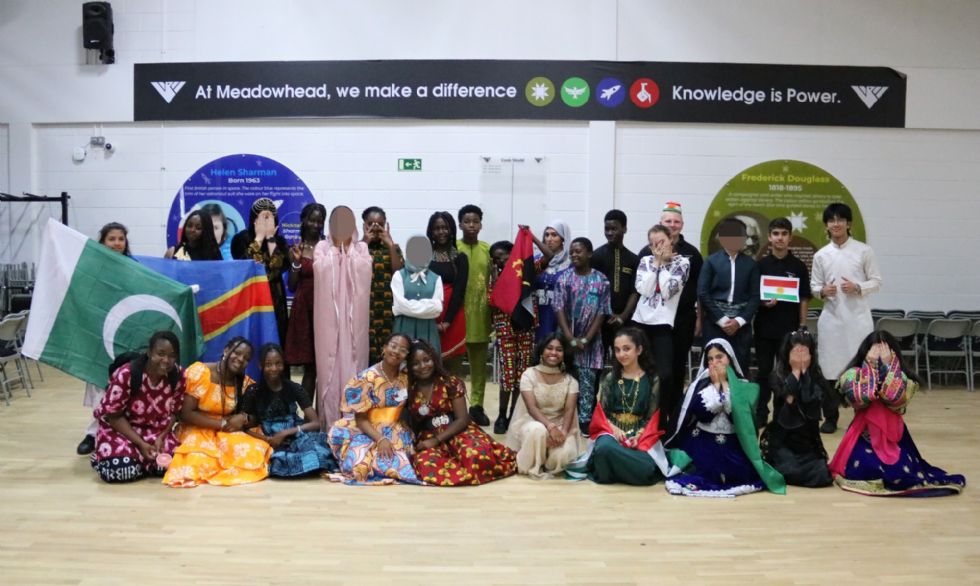 group of students dressed in cultural attire