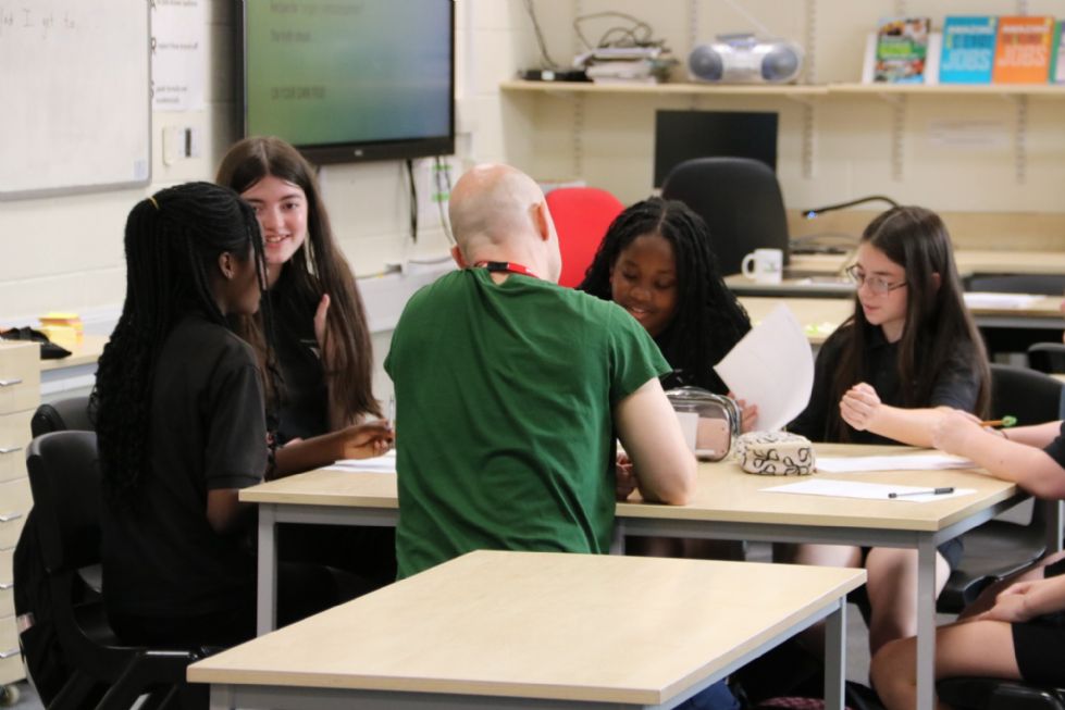 poet with students in a workshop
