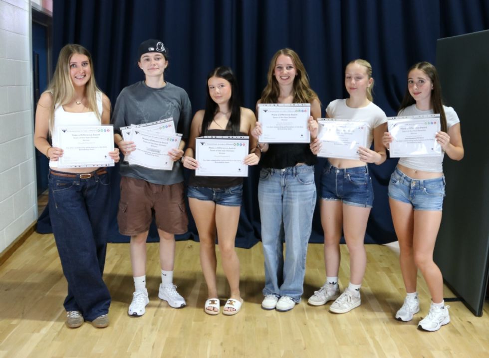 students with their award certificate