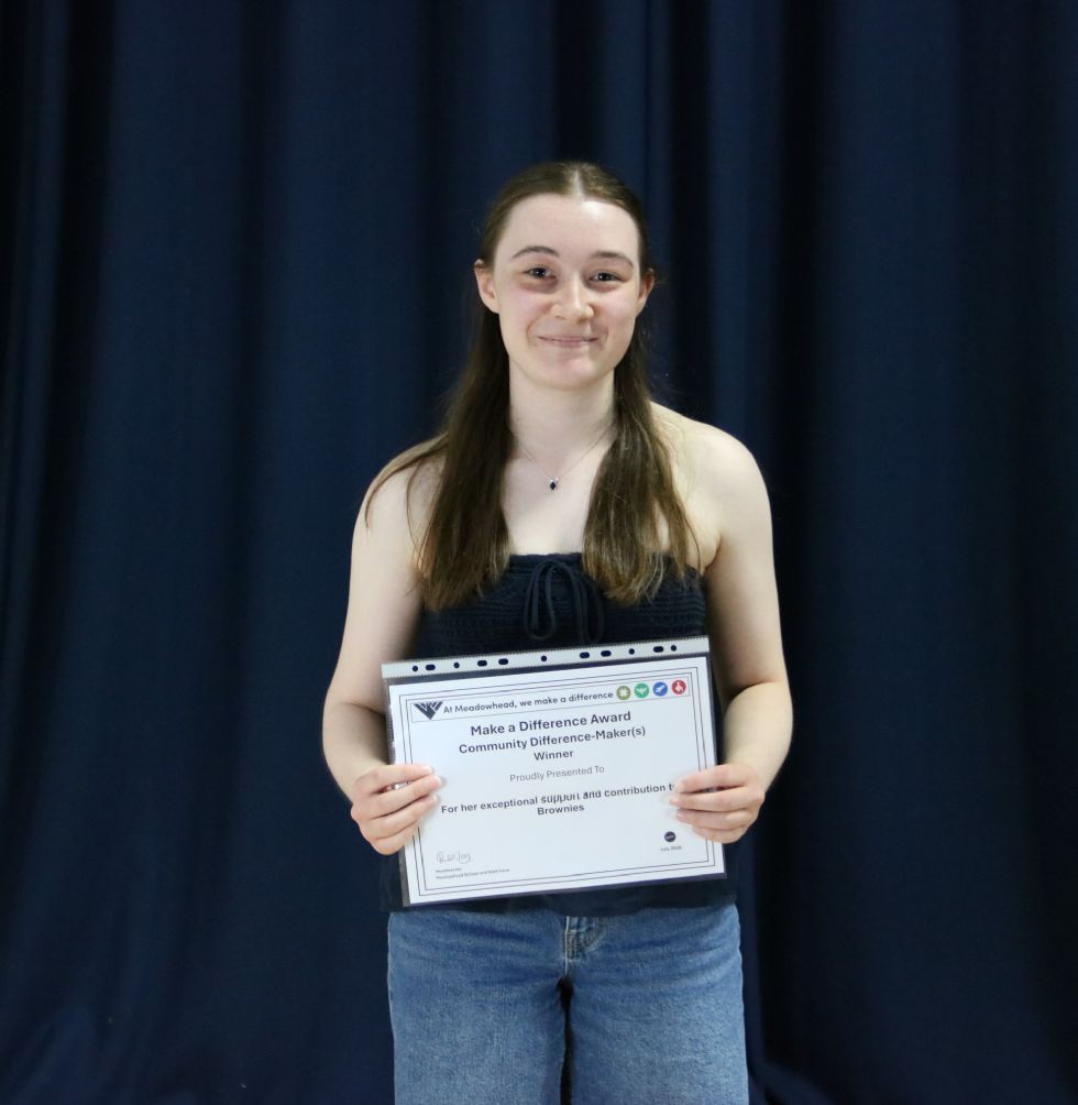 student with certificate at awards evening
