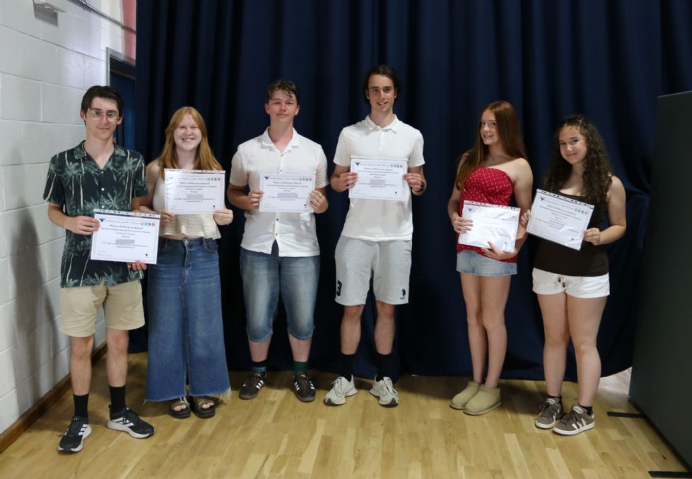 students with their award certificate