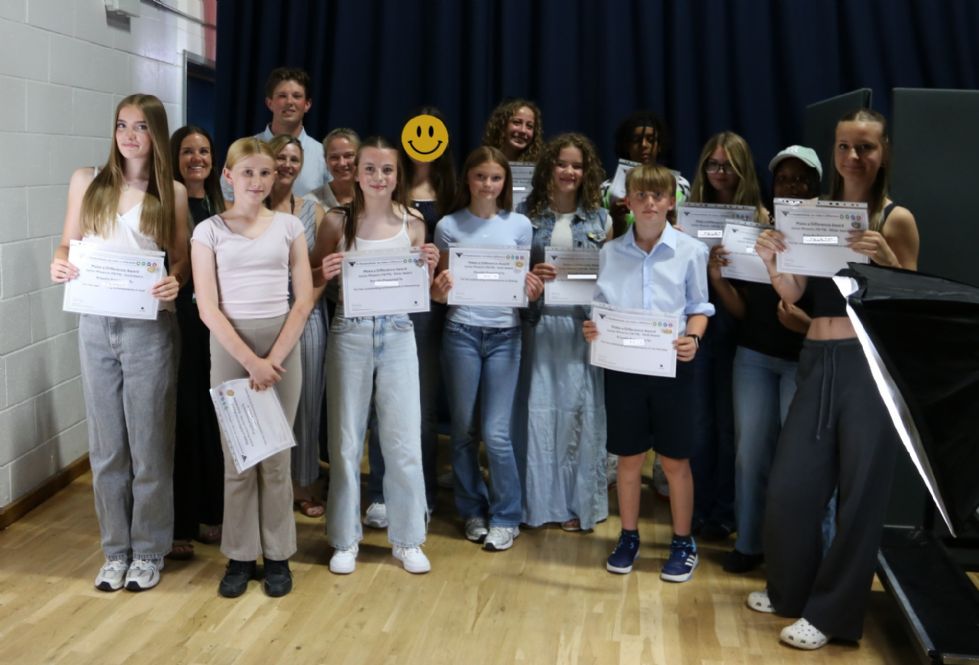 students with their award certificate