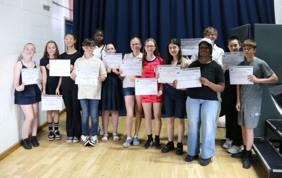students with their award certificate