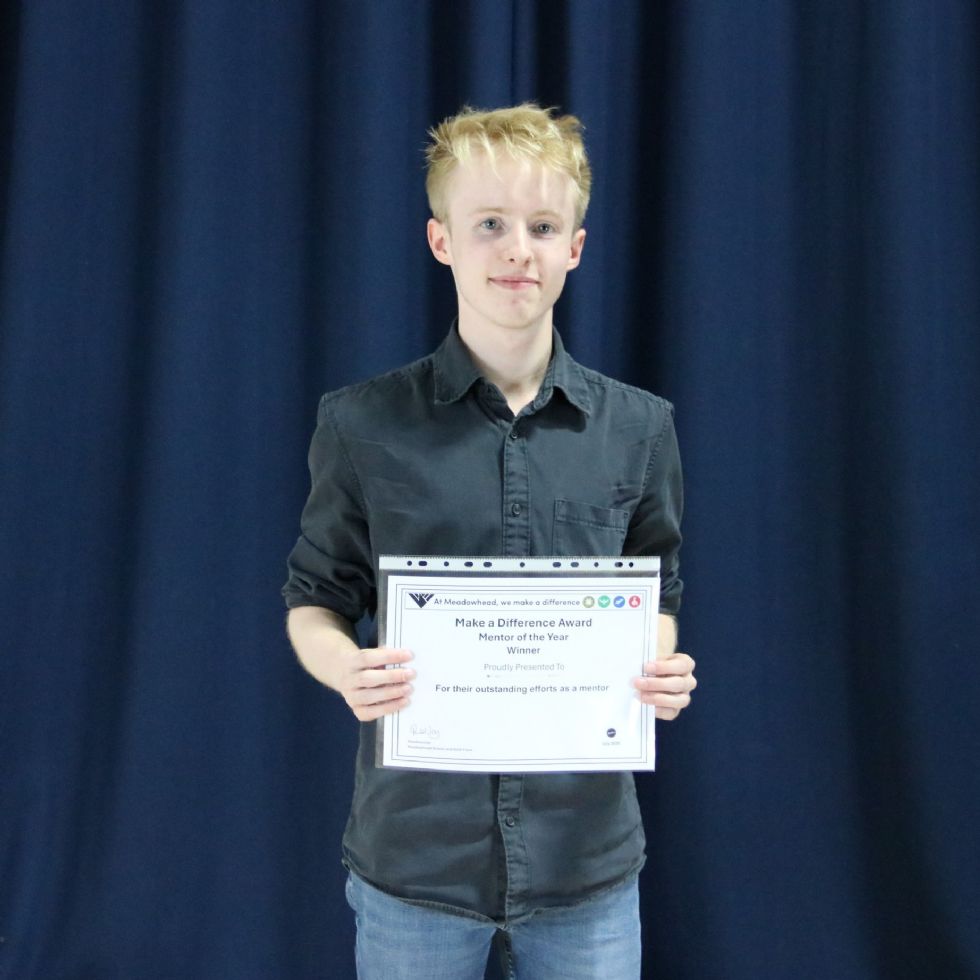 student with certificate at awards evening
