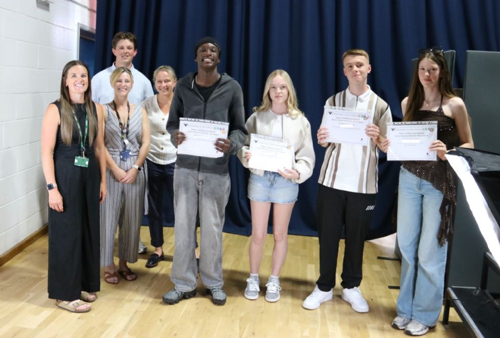 students with their award certificate