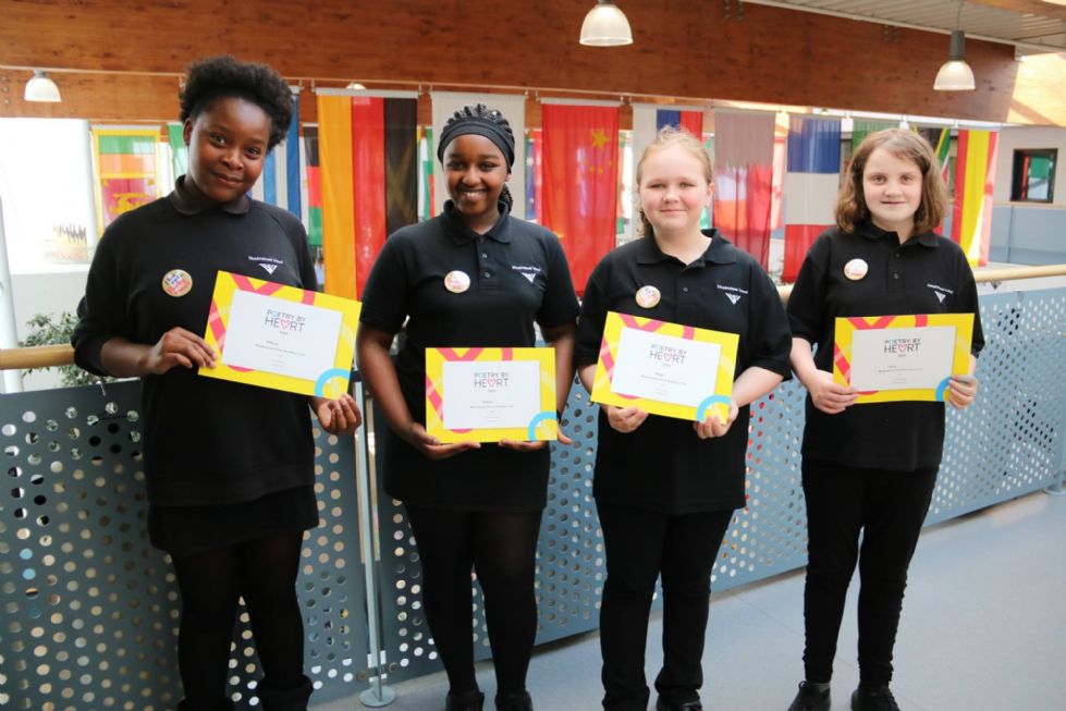 y7 students with their poetry by heart awards