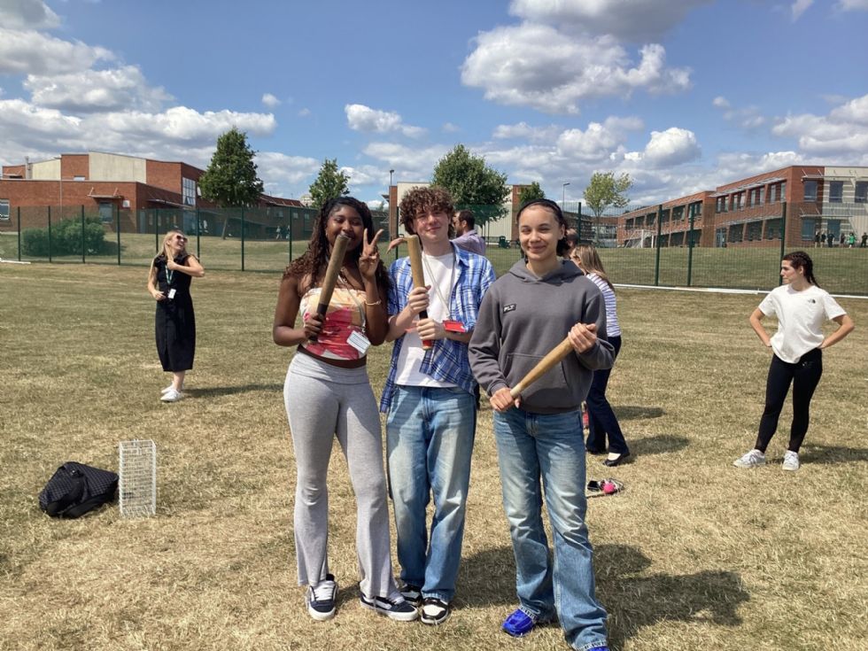 y11 students play rounders