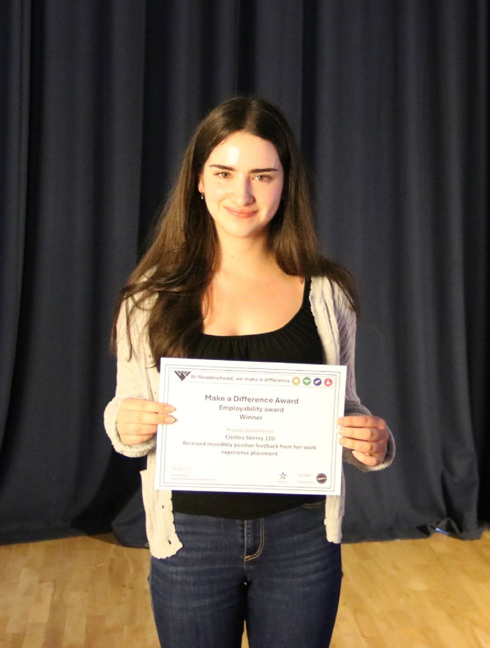 student with their make a difference award