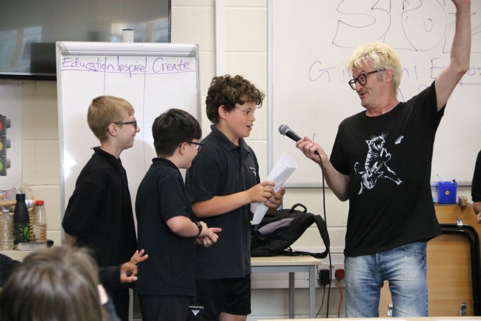 poet with students at the microphone in a poetry workshop