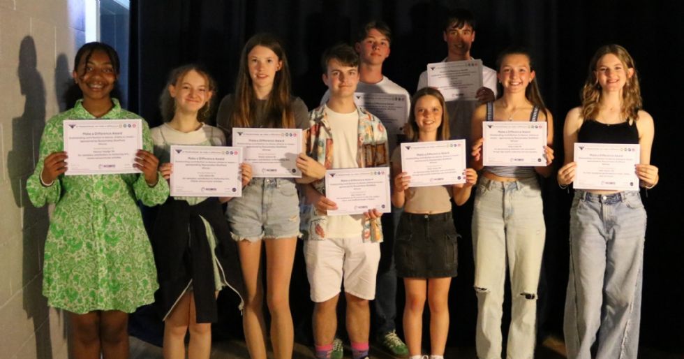 students with their make a difference awards