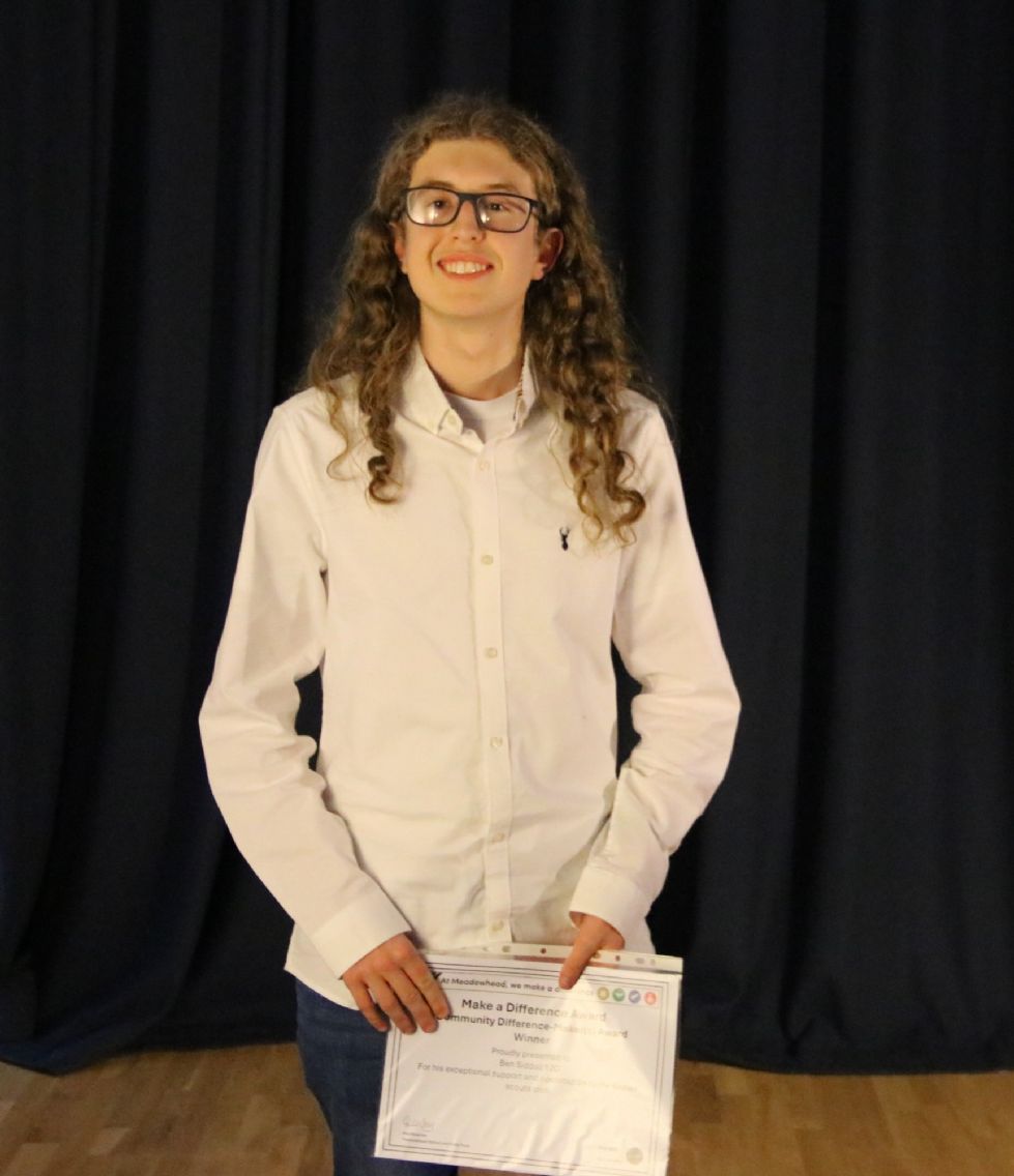 student with their make a difference award
