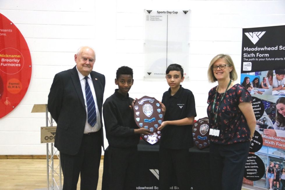 students with presented sports day shield