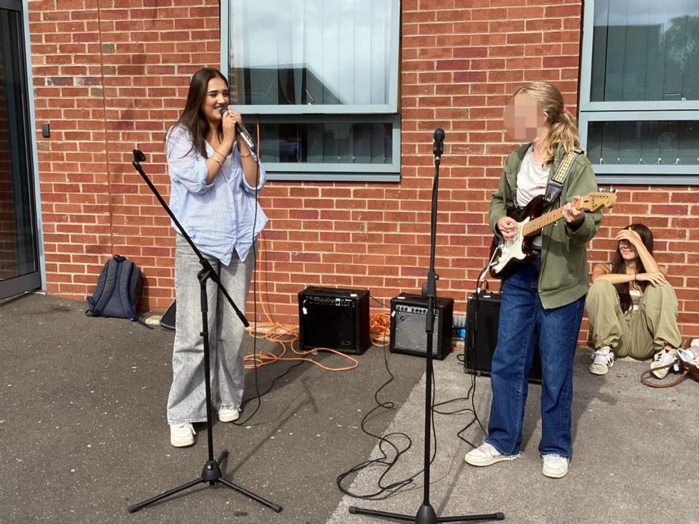 students sing at summer fair
