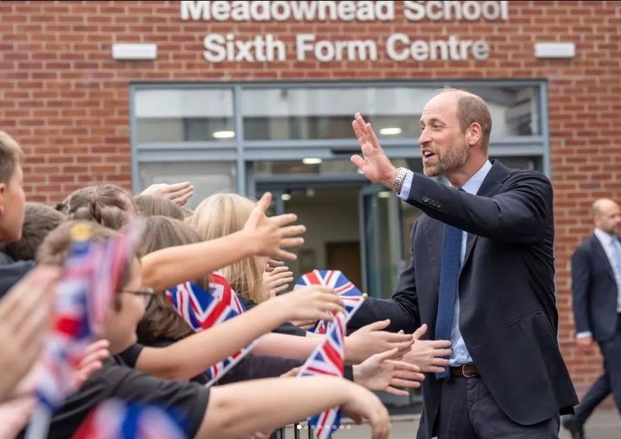 Prince William greets students outside the sixth form centre
