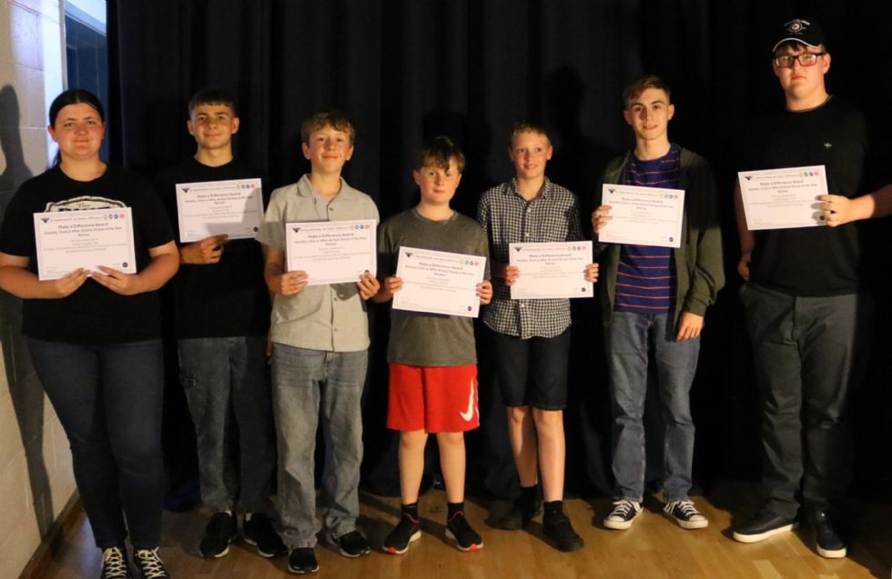 students with their make a difference awards