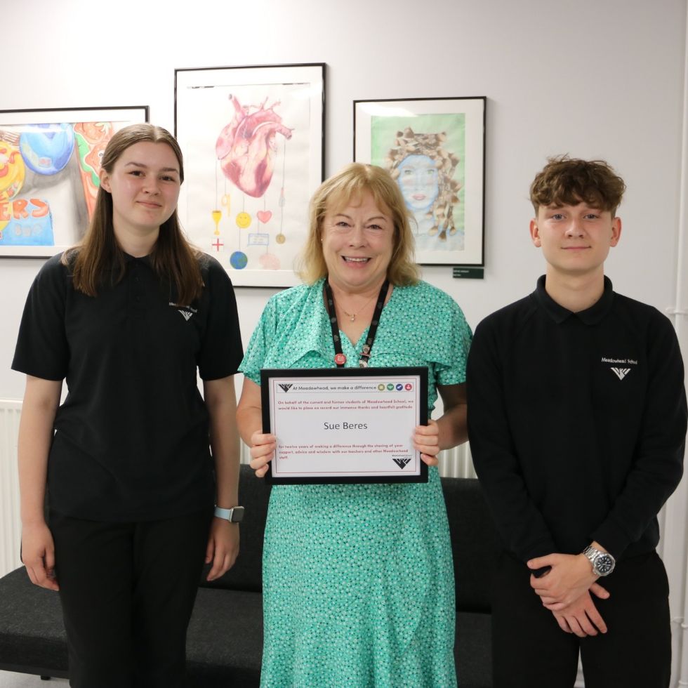 teacher being presented with make a difference award