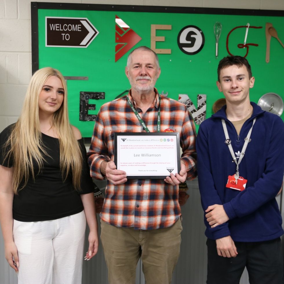 teacher being presented with make a difference award