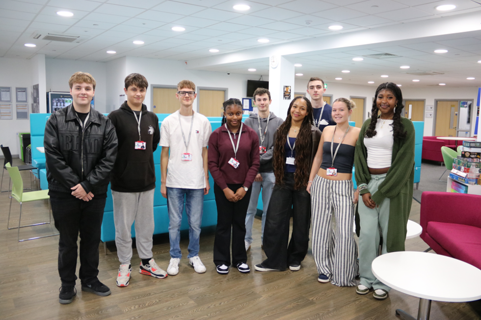sixth form presidents committee pose in a group in the sixth form centre