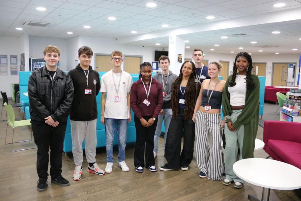 sixth form presidents committee pose in a group in the sixth form centre