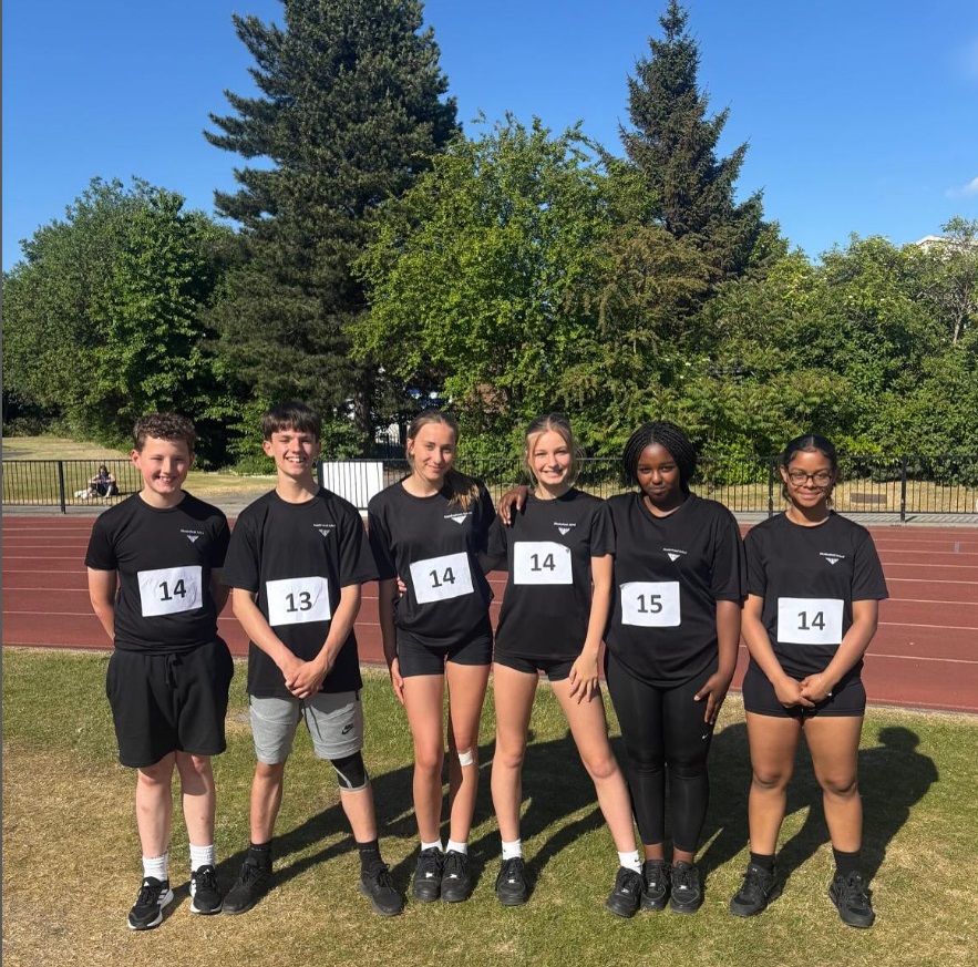 group of y8 students standing at the side of athletics track