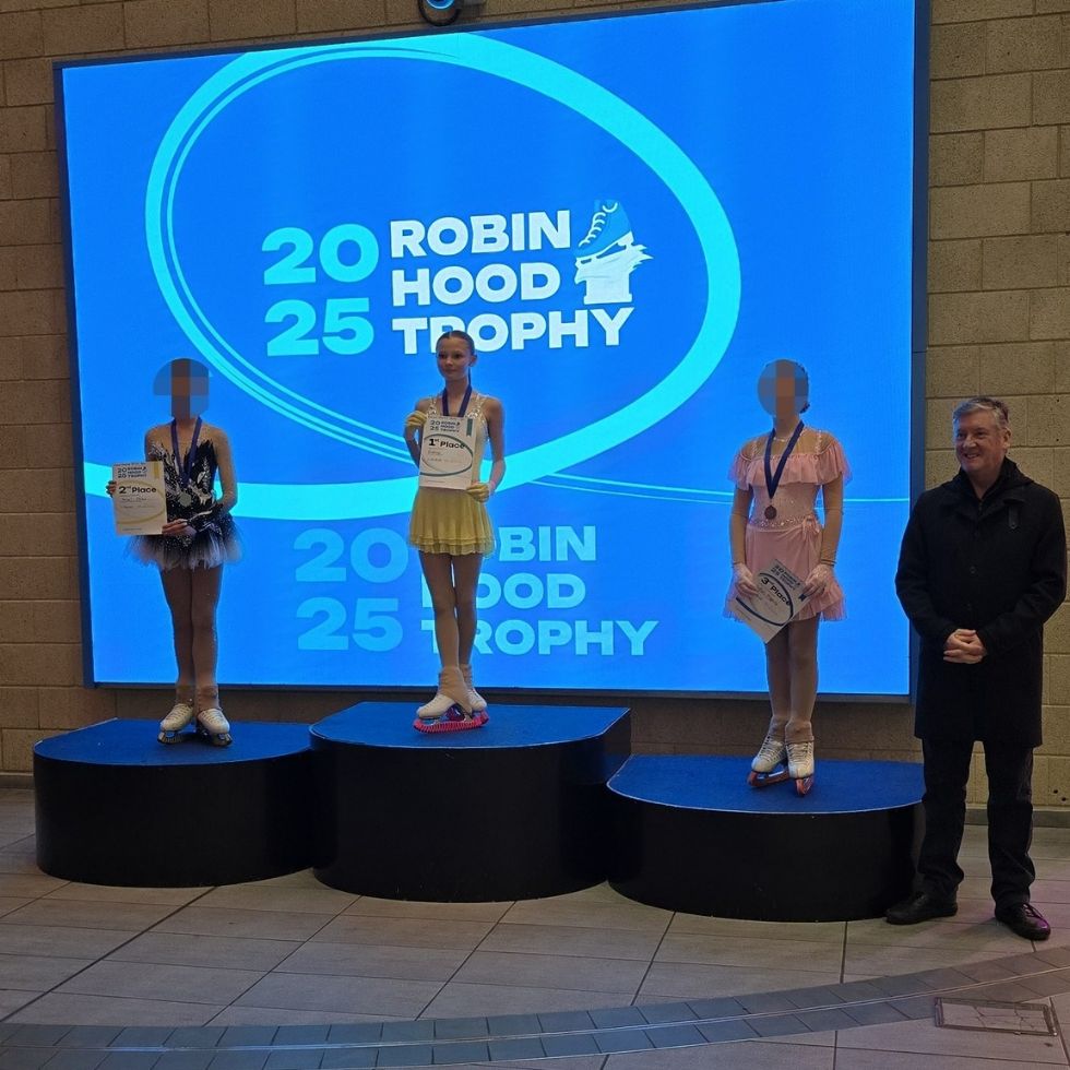 y8 student standing on podium in first place