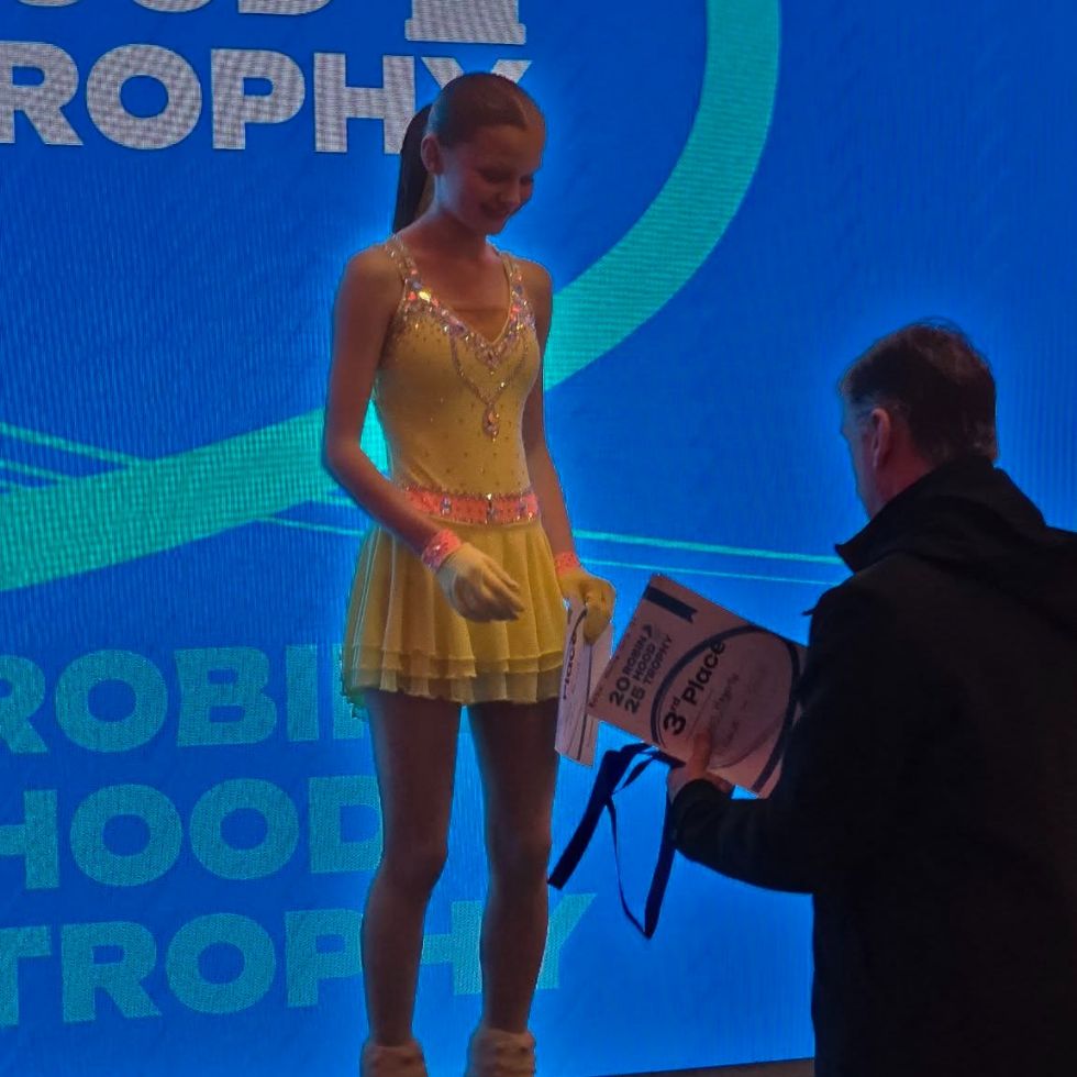 y8 student receives certificate from ice skater Robin Cousins