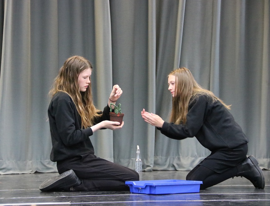 students rehearsing a Little Shop of Horrors