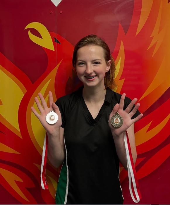 student with medals
