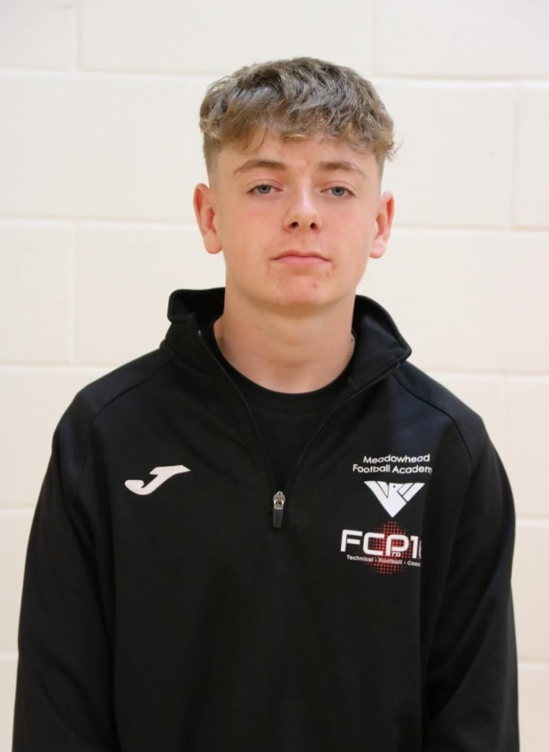 student poses for a photo as a player of the match