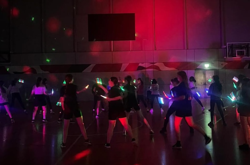 students at a light disco at the this girl can event