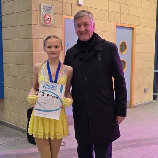 y8 student standing with ice skater Robin Cousins